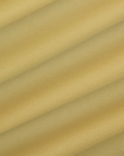 Fabric close up of the Butter Yellow Deep Cut Racerback
