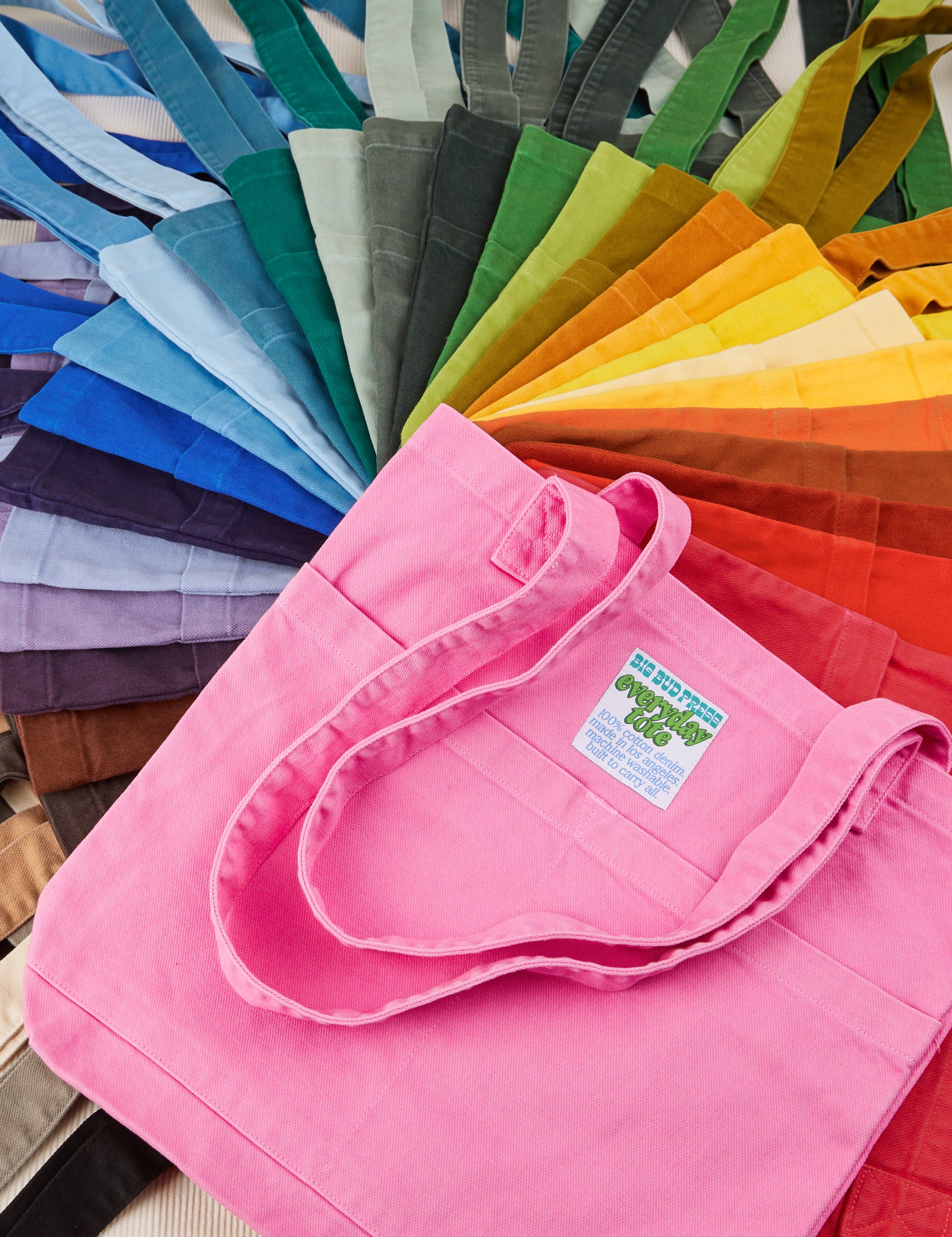 Stacked pile of Everyday Tote in a rainbow of hues