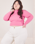 Ashley is wearing size L Essential Turtleneck in Bubblegum Pink paired with vintage tee off-white Western Pants