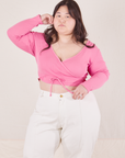 Ashley is wearing size 4 Wrap Top in Bubblegum Pink paired with vintage tee off-white Western Pants