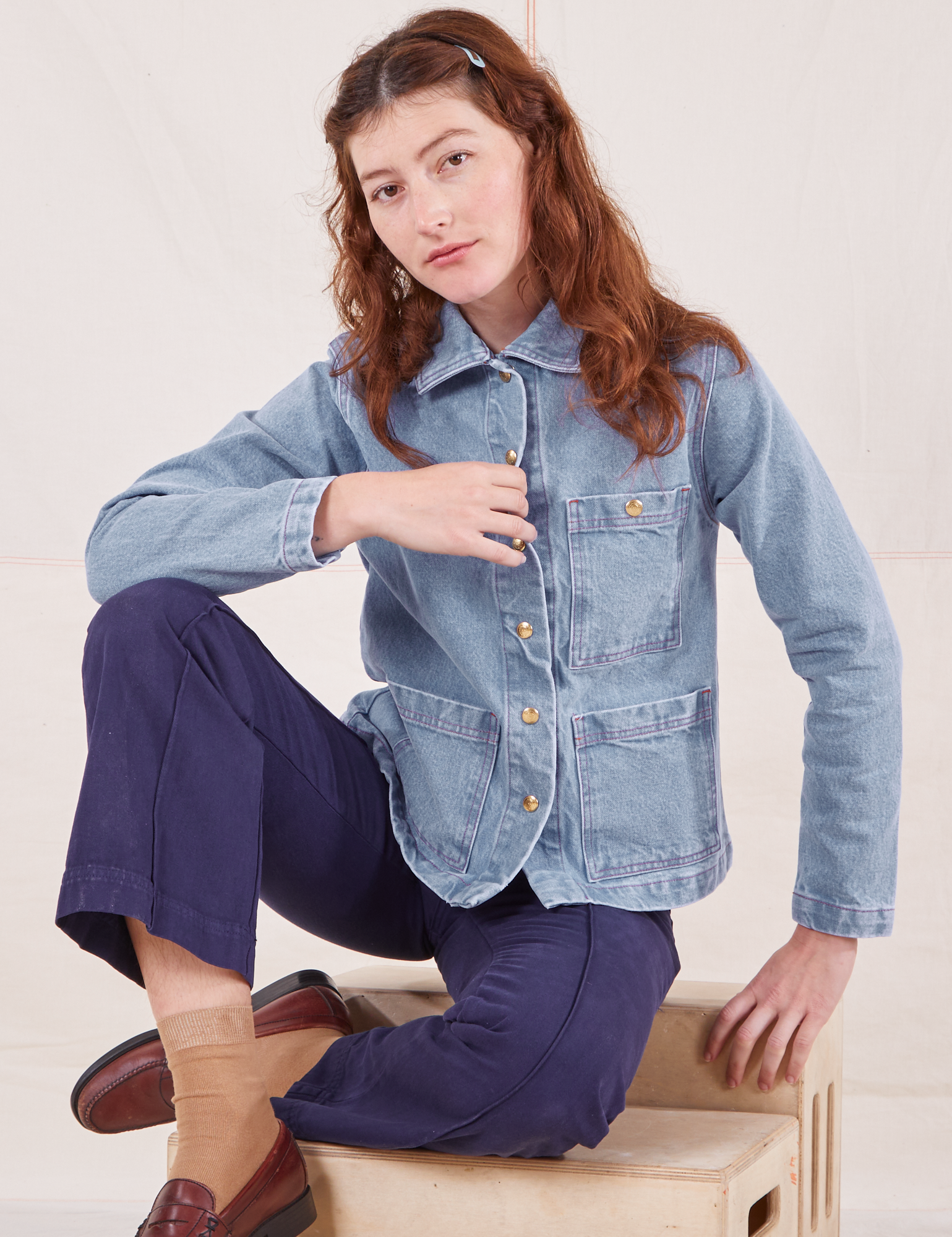 Alex is 5&#39;8&quot; and wearing XXS Indigo Denim Work Jacket in Light Wash paired with navy Western Pants