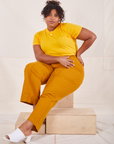 Morgan is wearing L Organic Vintage Tee in Sunshine Yellow paired with spicy mustard Western Pants