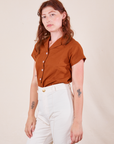 Alex is wearing P Pantry Button-Up in Burnt Terracotta paired with vintage tee off-white Western Pants