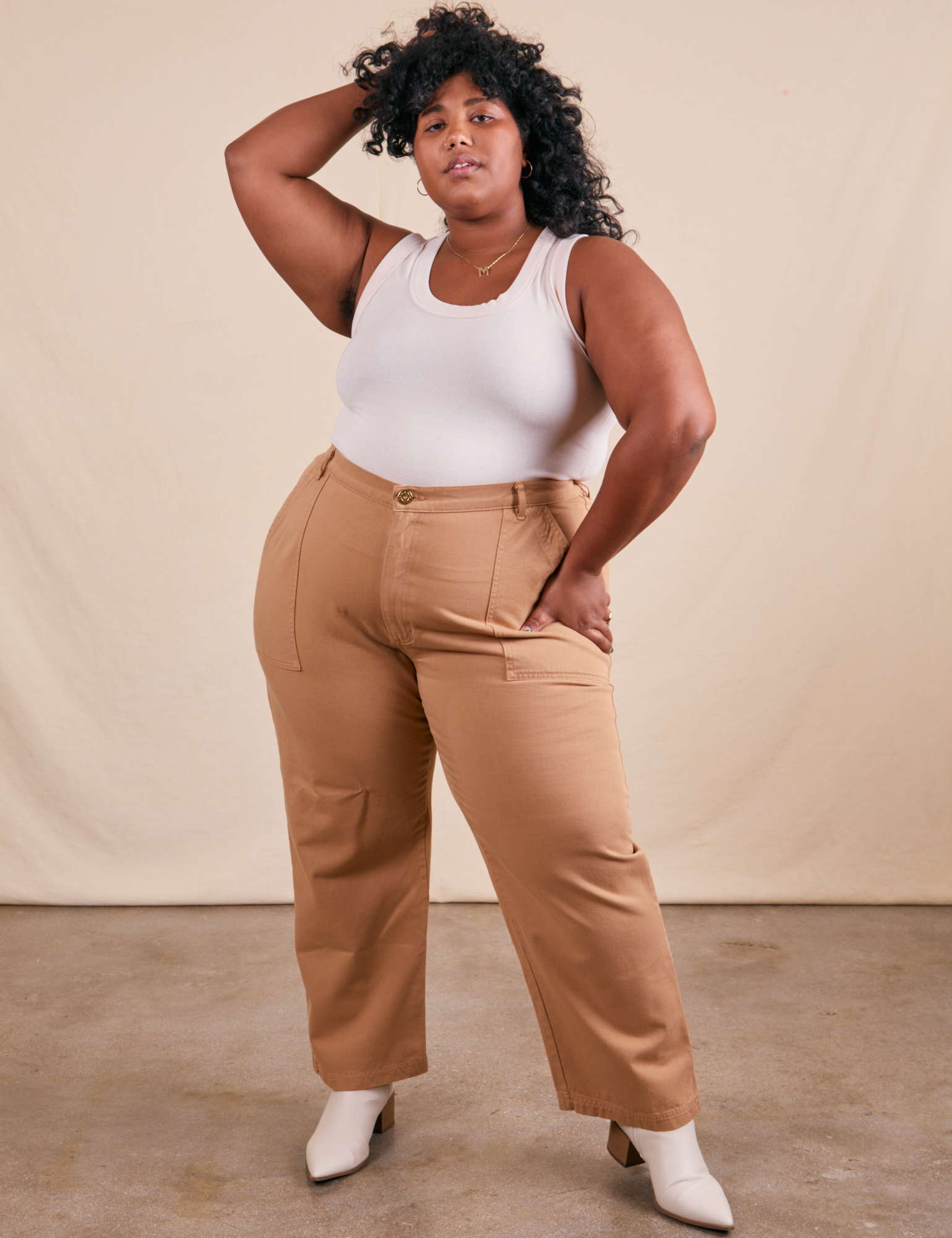 Morgan is 5&#39;5&quot; and wearing 3XL Work Pants in Tan paired with Tank Top in vintage tee off-white