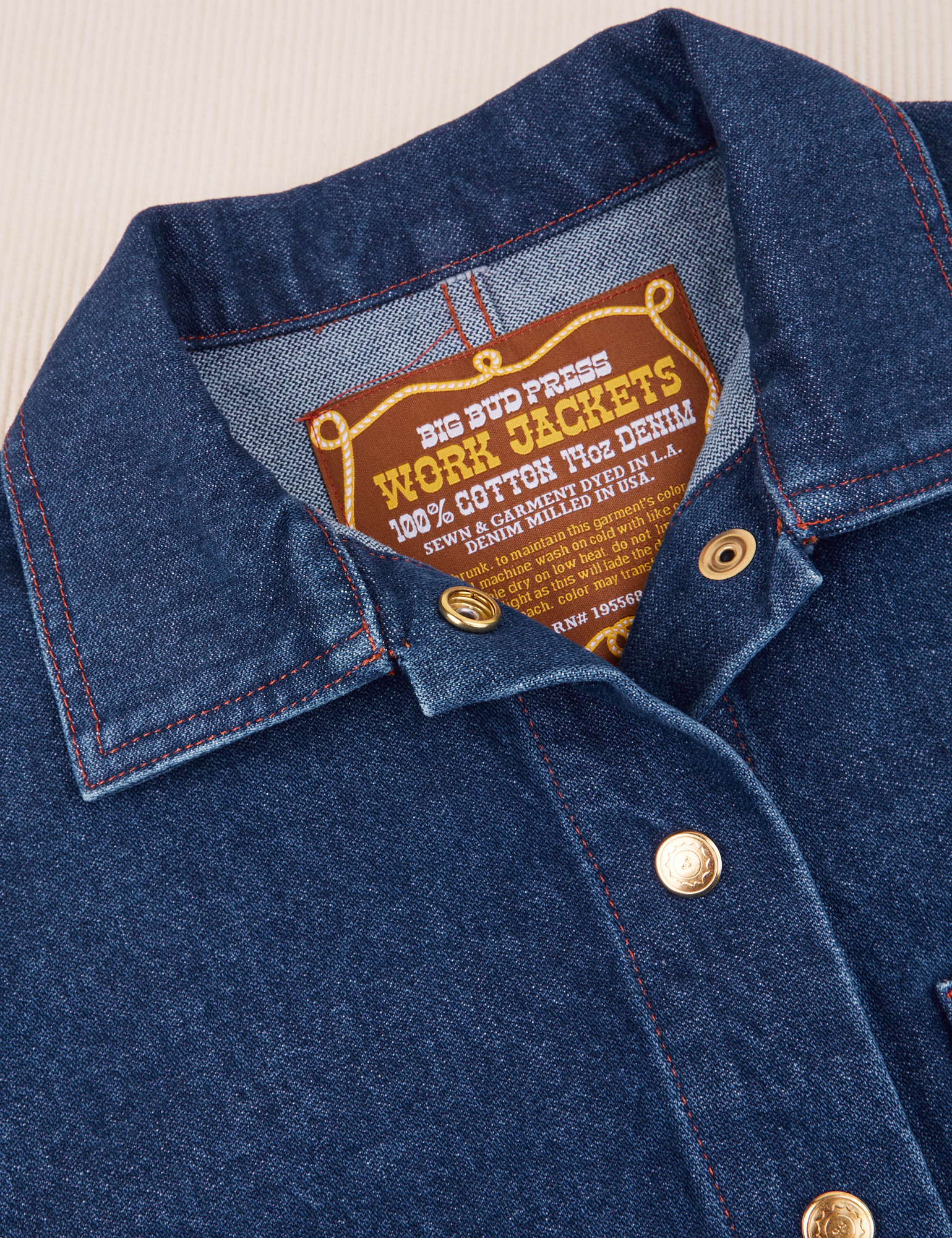 Indigo Denim Work Jacket in Dark Wash collar and brass button close up