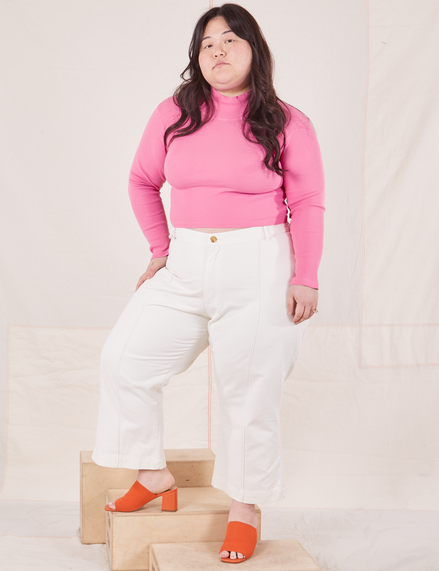 Ashley is wearing Essential Turtleneck in Bubblegum Pink and vintage tee off-white Western Pants