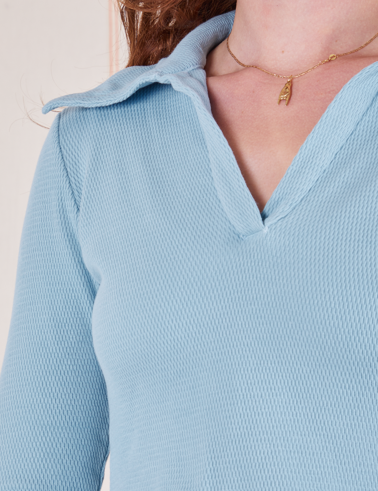 Front close up of Long Sleeve Fisherman Polo in Baby Blue worn by Alex