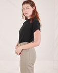 Side view of Organic Vintage Tee in Basic Black and khaki grey Western Pants worn by Alex