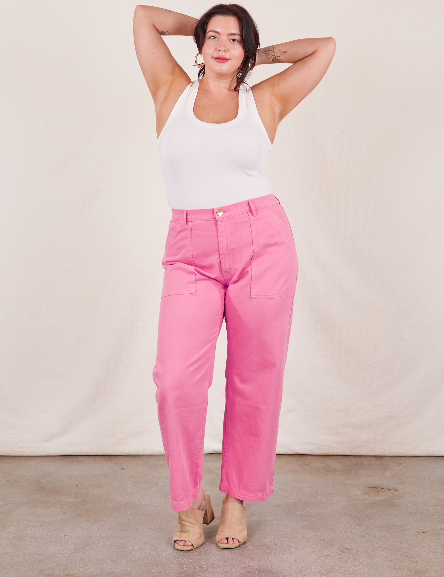 Faye is wearing Work Pants in Bubblegum Pink and a Tank Top in vintage tee off-white
