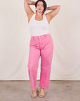Faye is wearing Work Pants in Bubblegum Pink and a Tank Top in vintage tee off-white