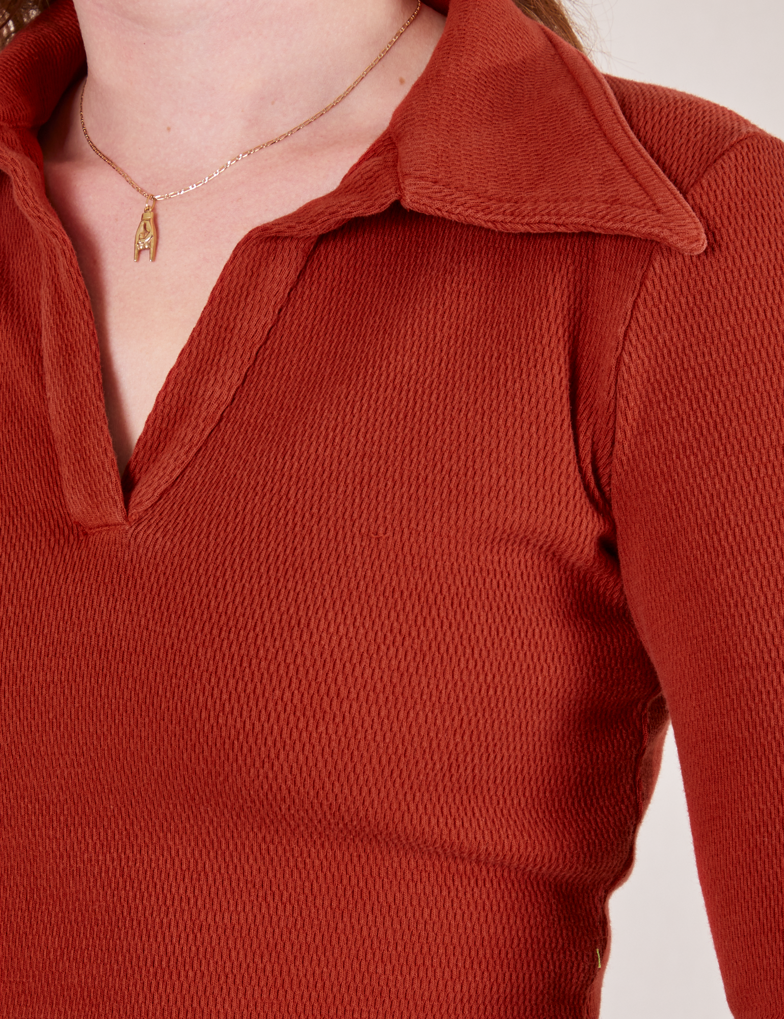 Front close up of Long Sleeve Fisherman Polo in Paprika worn by Alex