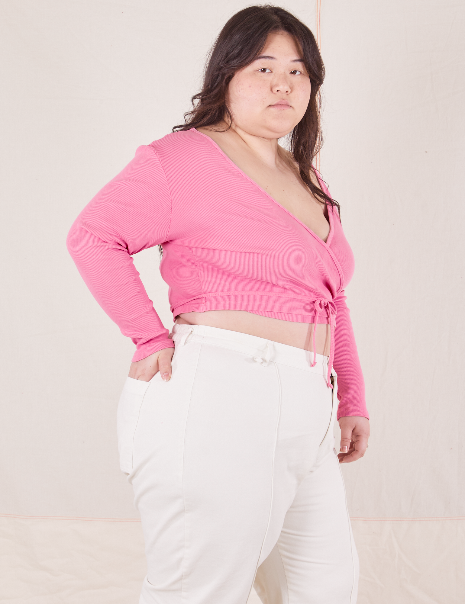 Wrap Top in Bubblegum Pink side view on Ashley wearing vintage tee off-white Western Pants