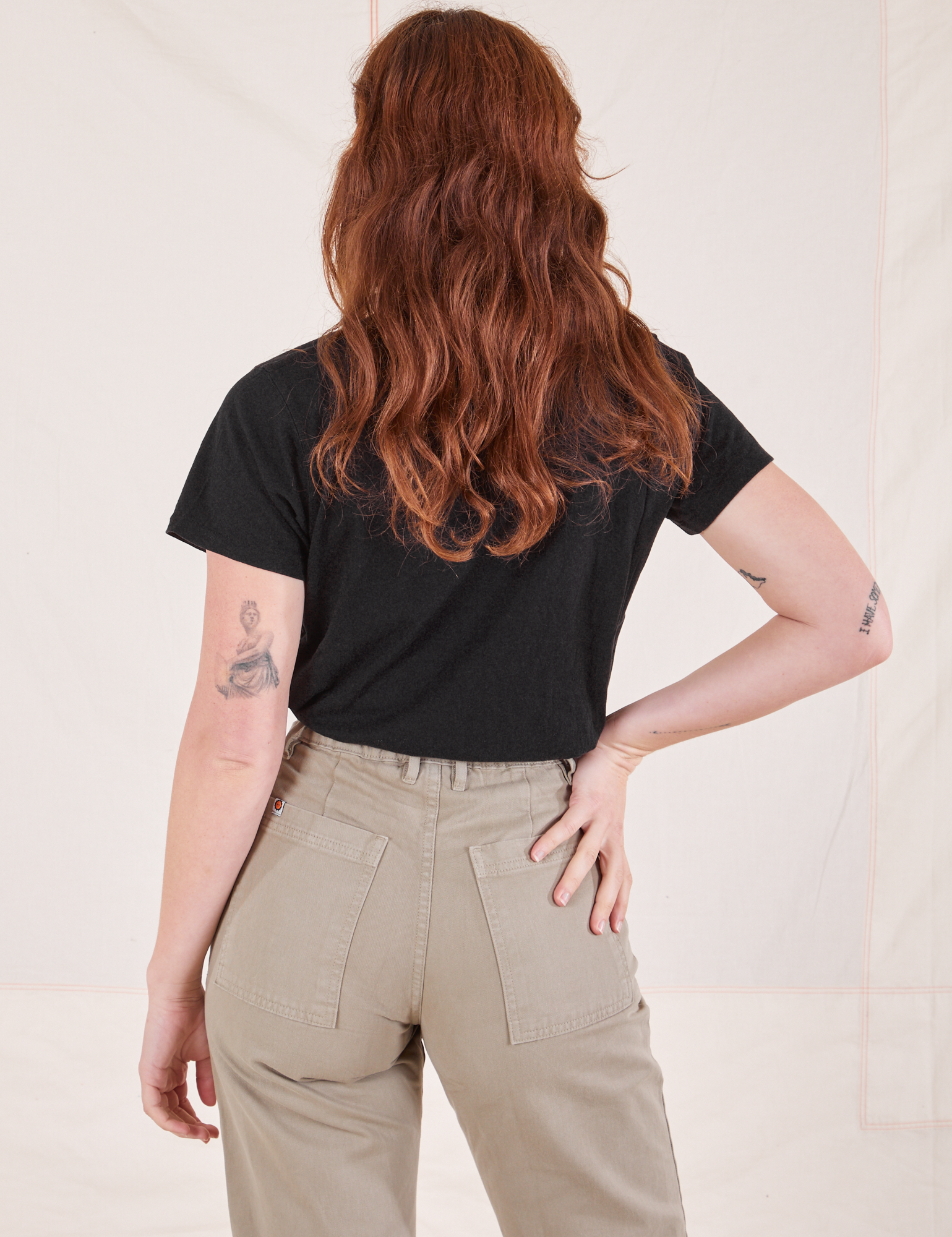Back view of Organic Vintage Tee in Basic Black worn by Alex