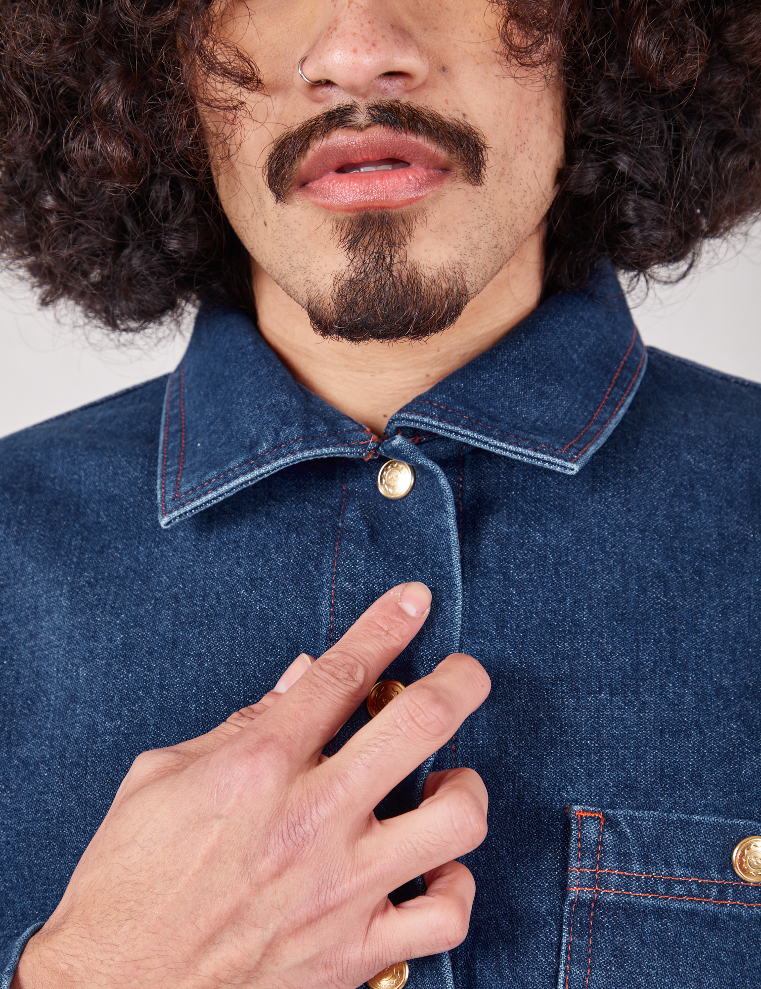 Front close up of Indigo Denim Work Jacket in Dark Wash worn by Jesse
