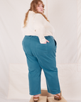 Angled back view of Organic Work Pants in Marine Blue worn by Catie