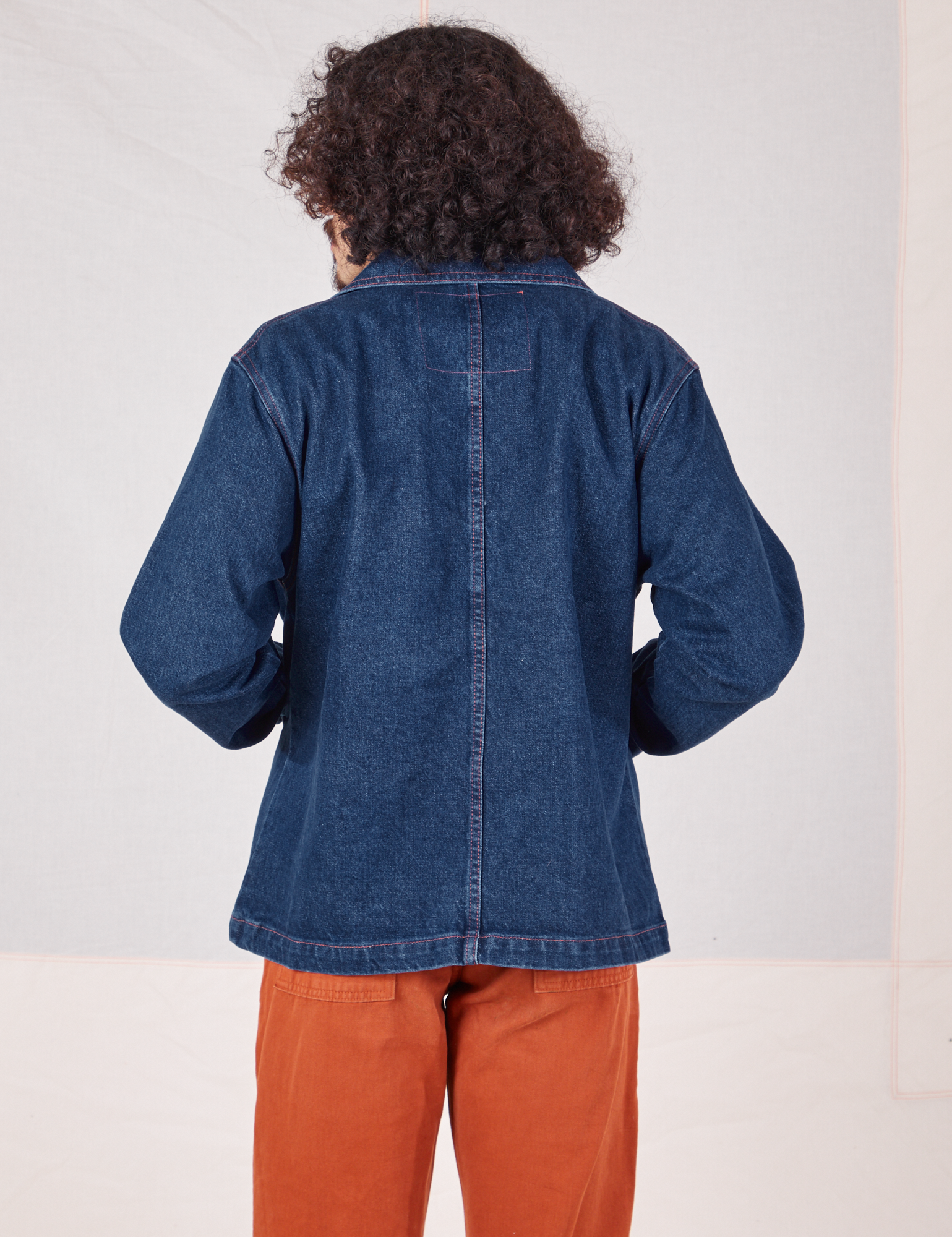 Back view of Indigo Denim Work Jacket in Dark Wash worn by Jesse