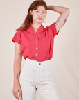 Alex is wearing Pantry Button-Up in Hot Pink tucked into vintage tee off-white Western Pants