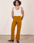 Jesse is 5'8" and wearing XS Western Pants in Spicy Mustard paired with vintage off-white Tank Top