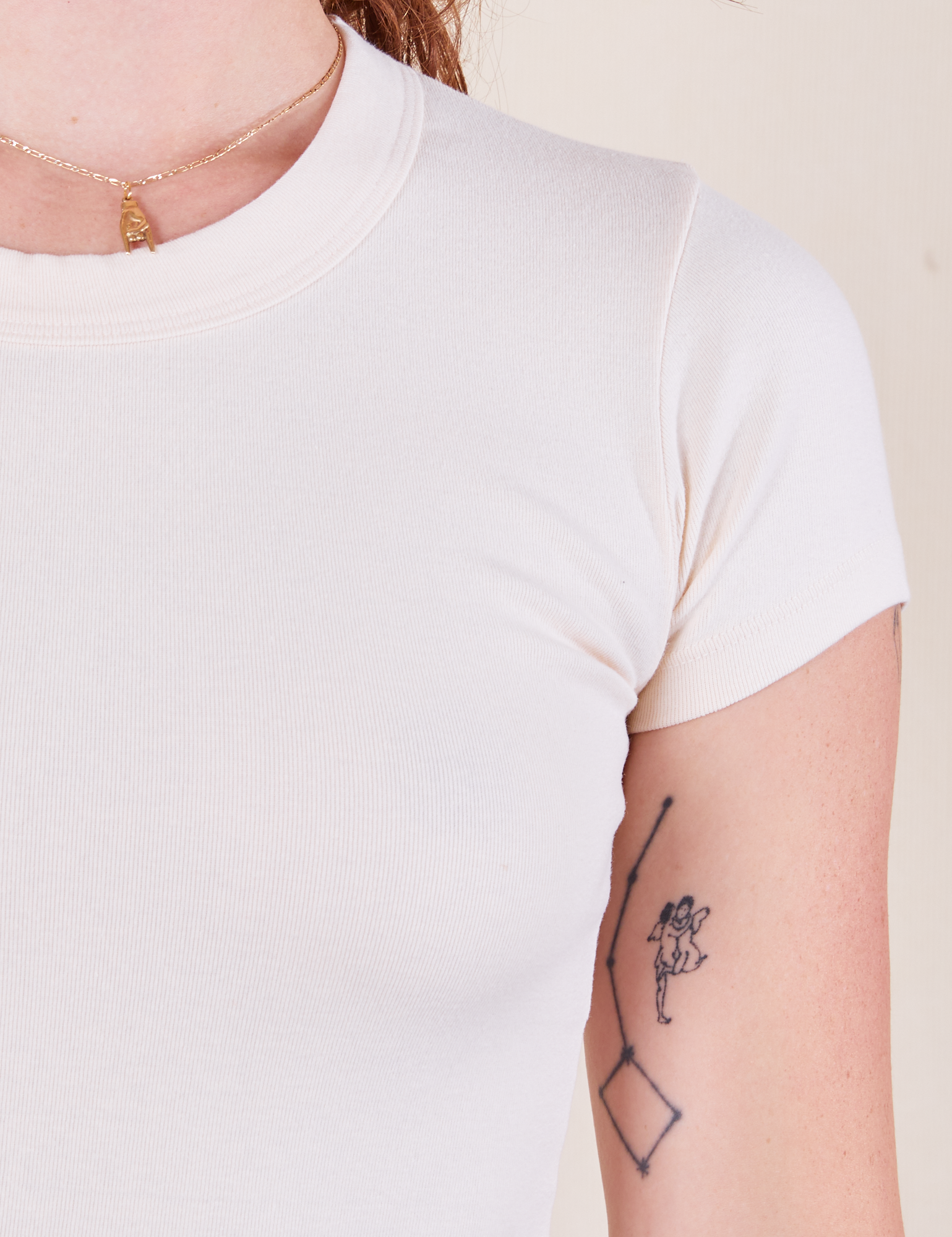 Front close up of Baby Tee in Vintage Tee Off-White on Alex