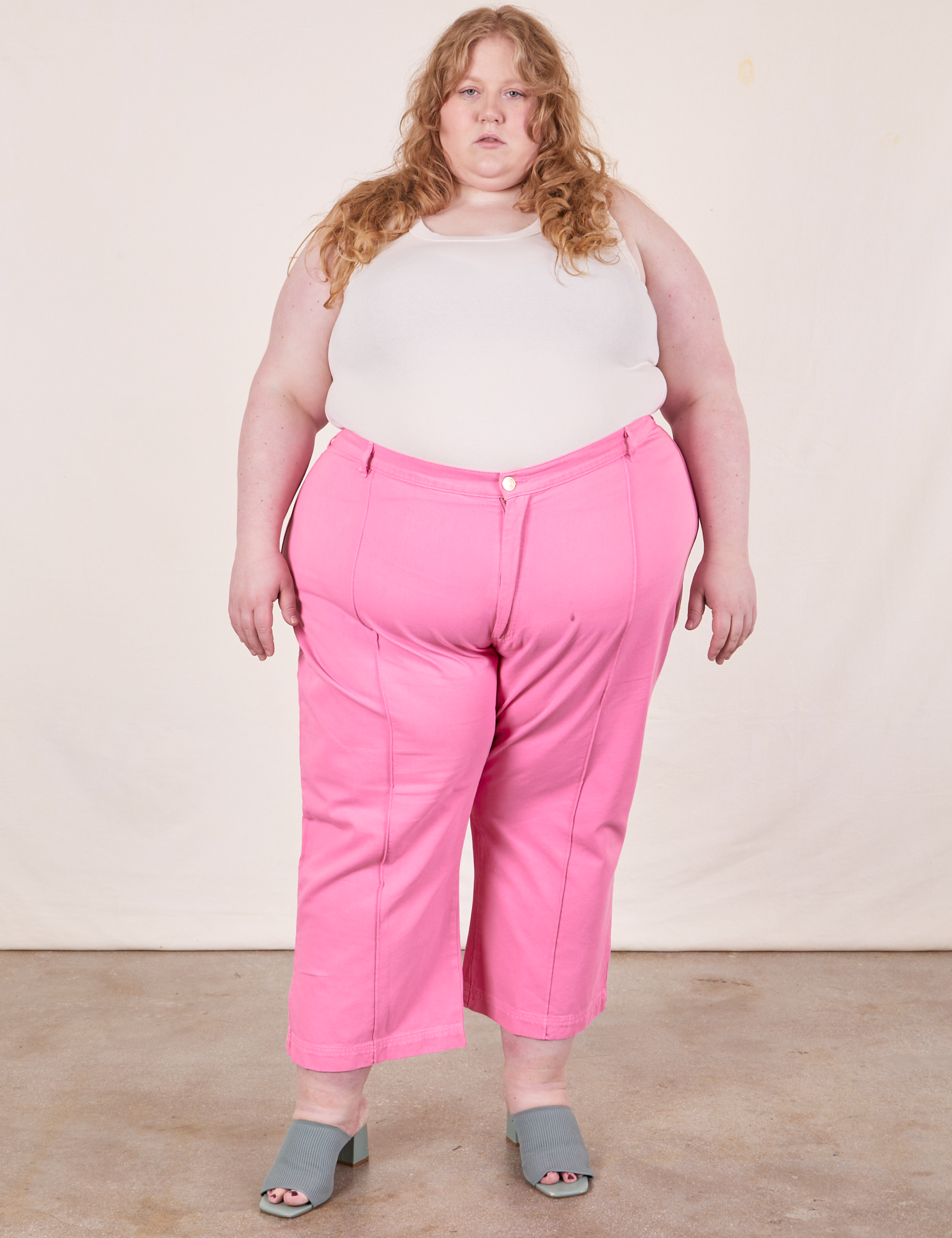 Catie is 5&#39;11&quot; and wearing size 5XL Western Pants in Bubblegum Pink paired with Tank Top in vintage tee off-white