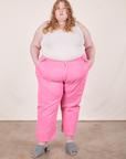 Catie is 5'11" and wearing size 5XL Work Pants in Bubblegum Pink paired with Tank Top in vintage tee off-white