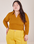 Ashley is wearing size L Long Sleeve Fisherman Polo in Spicy Mustard