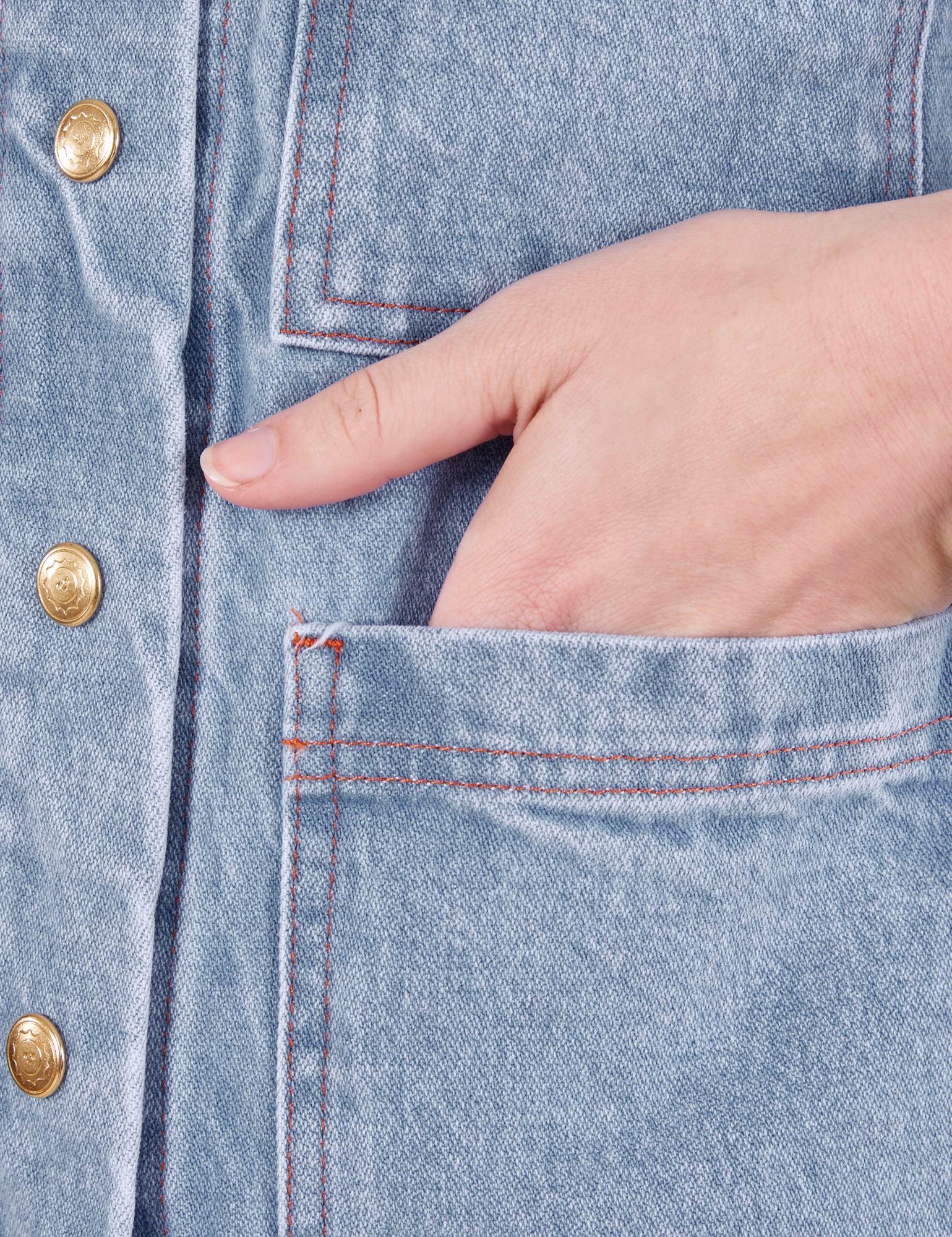 Indigo Denim Work Jacket in Light Wash hand in front pocket close up on Alex