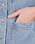 Indigo Denim Work Jacket in Light Wash hand in front pocket close up on Alex