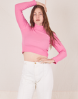 Allison is wearing XXS Essential Turtleneck in Bubblegum Pink paired with vintage tee off-white Western Pants