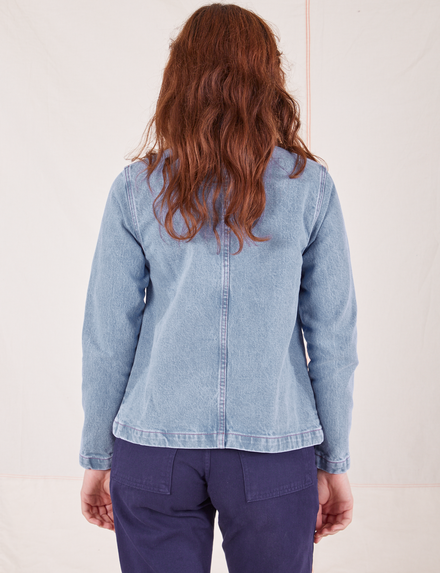 Back view of Indigo Denim Work Jacket in Light Wash worn by Alex