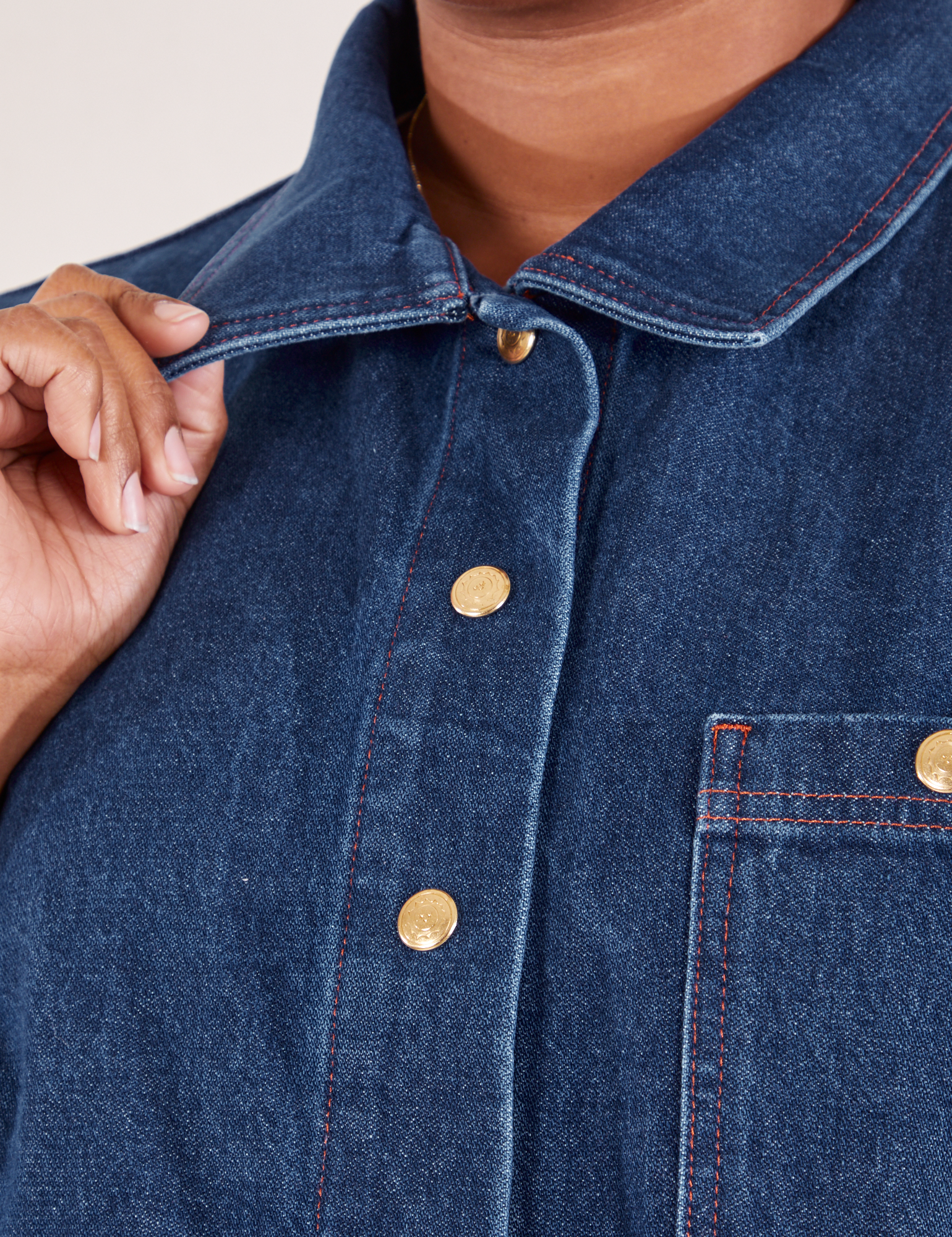 Indigo Denim Work Jacket in Dark Wash front close up on Morgan holding collar point