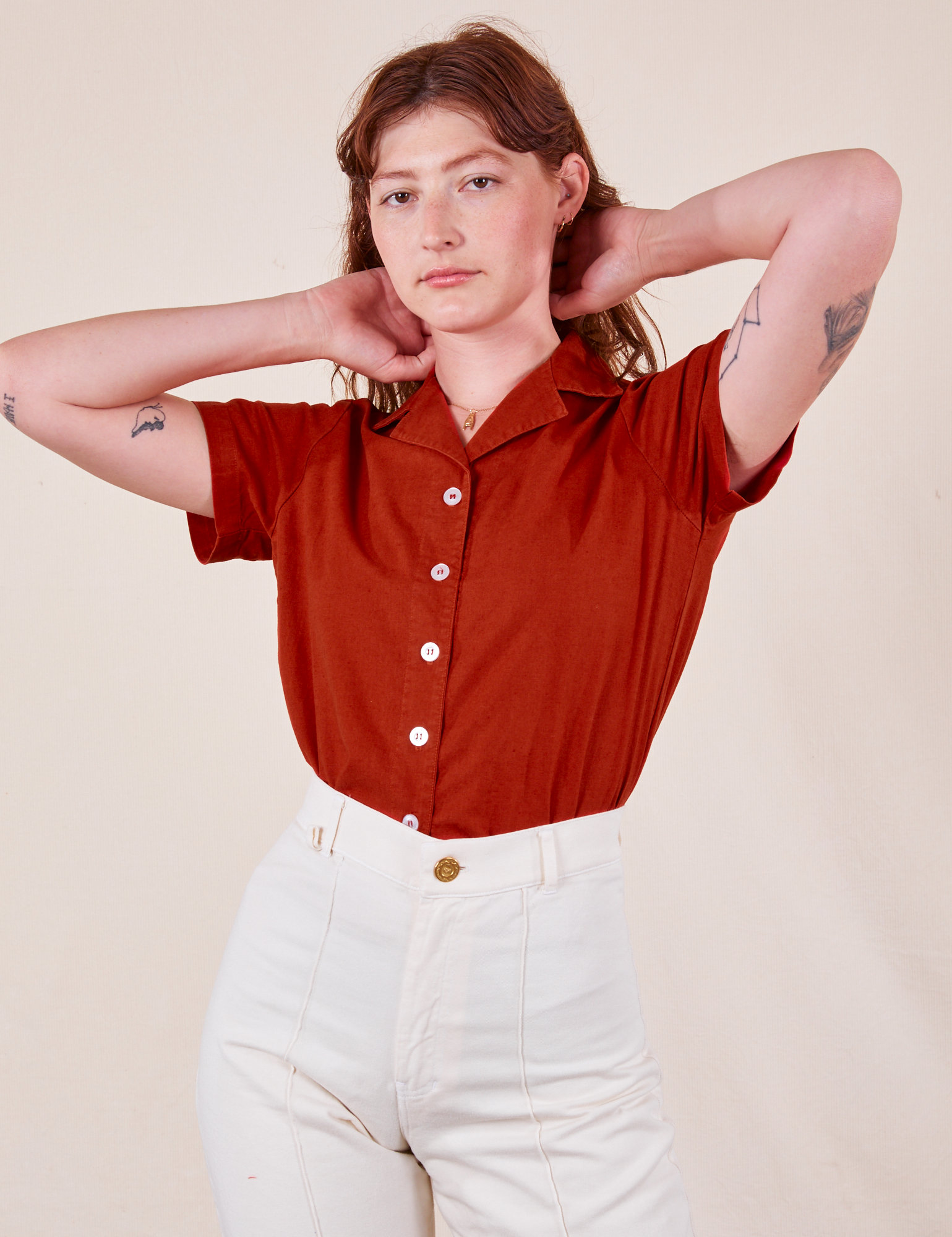 Alex is wearing P Pantry Button-Up in Paprika tucked into vintage tee off-white Western Pants