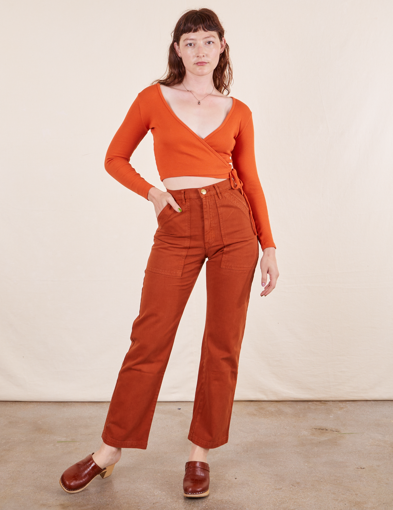Alex is 5'8" and wearing XS Work Pants in Burnt Terracotta