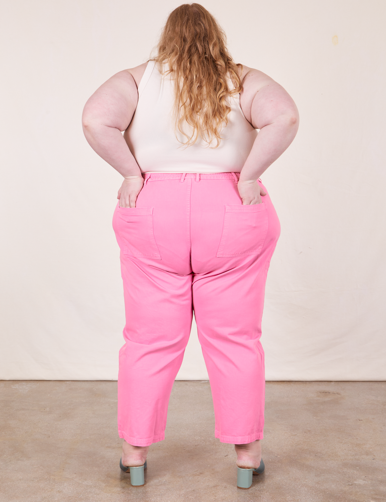 Work Pants in Bubblegum Pink back view on Catie wearing Tank Top in vintage tee off-white