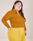 Side view of Long Sleeve Fisherman Polo in Spicy Mustard worn by Ashley