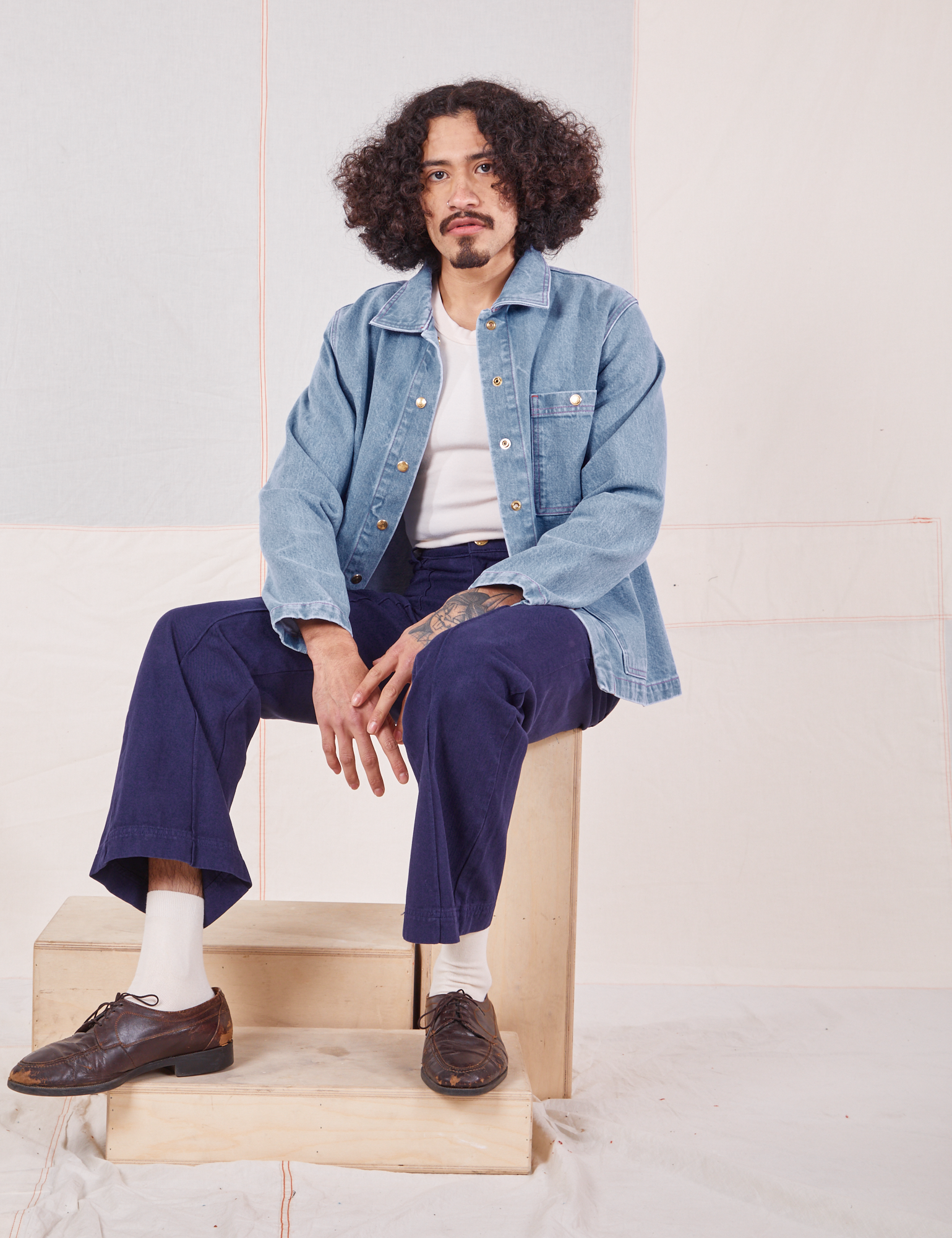 Jesse is 5'8" and wearing S Indigo Denim Work Jacket in Light Wash