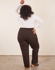 Back view of Work Pants in Espresso Brown and Long Sleeve V-Neck Tee in vintage tee off-white on Morgan