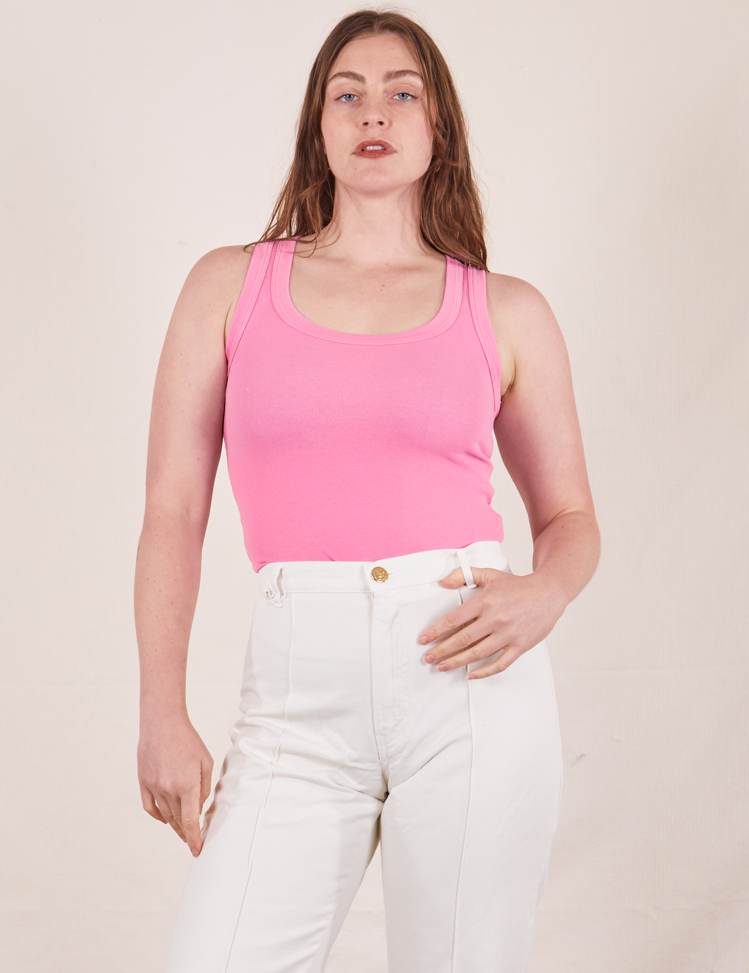 Allison is wearing size XXS Tank Top in Bubblegum Pink paired with vintage off-white Western Pants