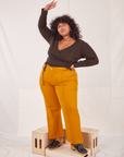 Morgan is wearing Wrap Top in Espresso Brown and spicy mustard Western Pants