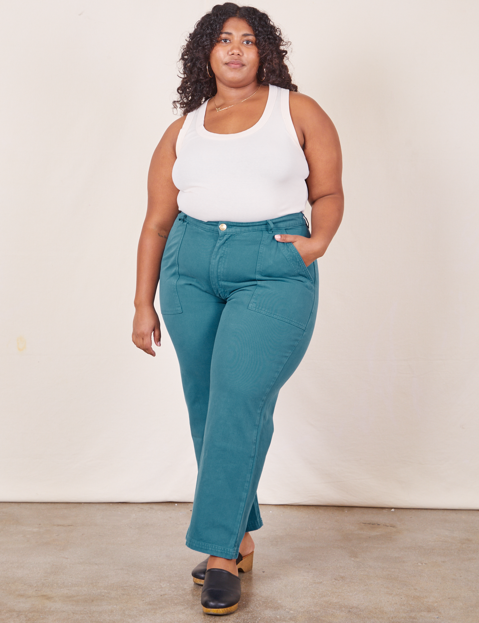 Morgan is 5&#39;5&quot; and wearing size 1XL Work Pants in Marine Blue paired with Tank Top in vintage tee off-white
