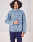 Jesse is wearing Indigo Denim Work Jacket in Light Wash and navy Western Pants