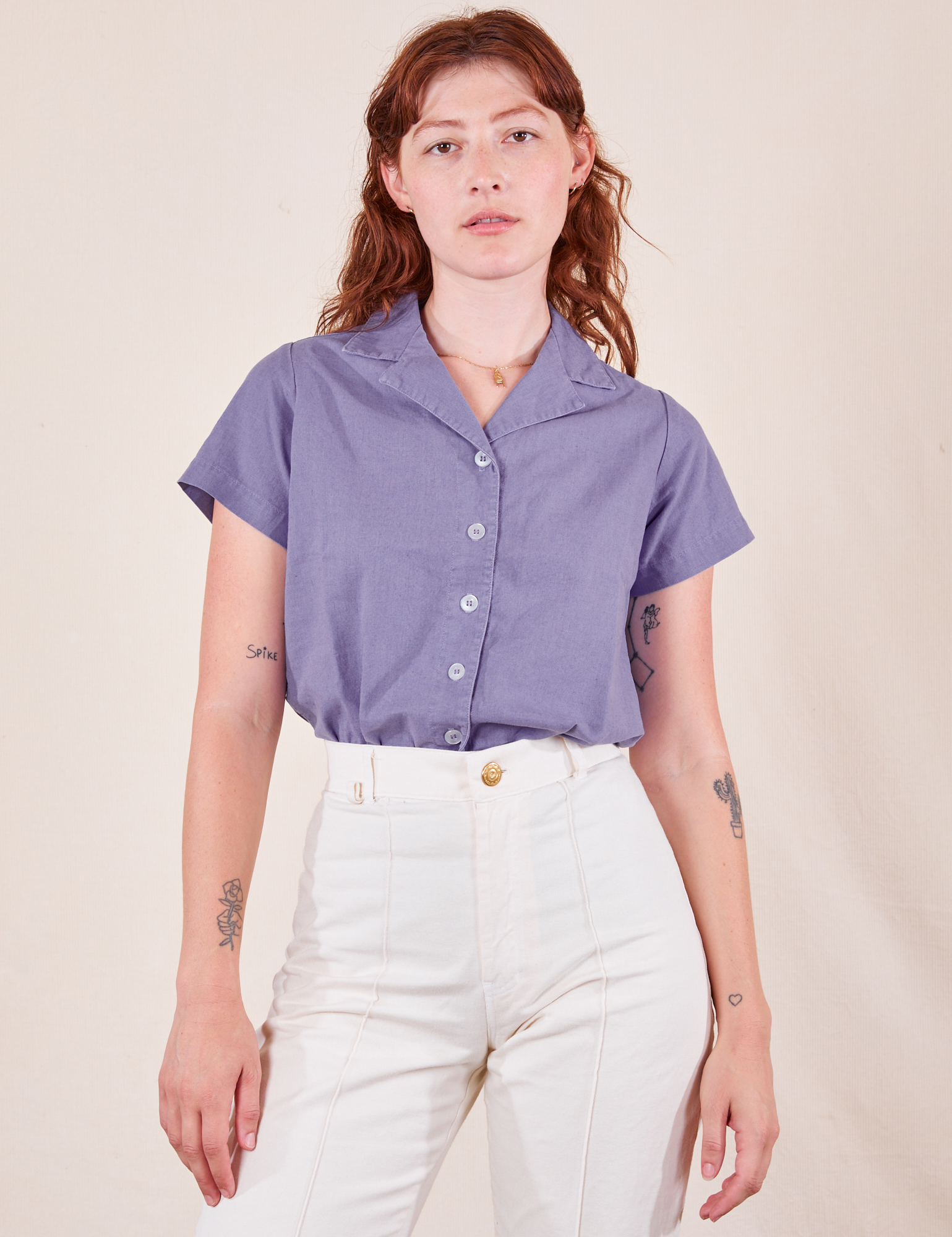 Alex is wearing P Pantry Button-Up in Faded Grape tucked into vintage tee off-white Western Pants