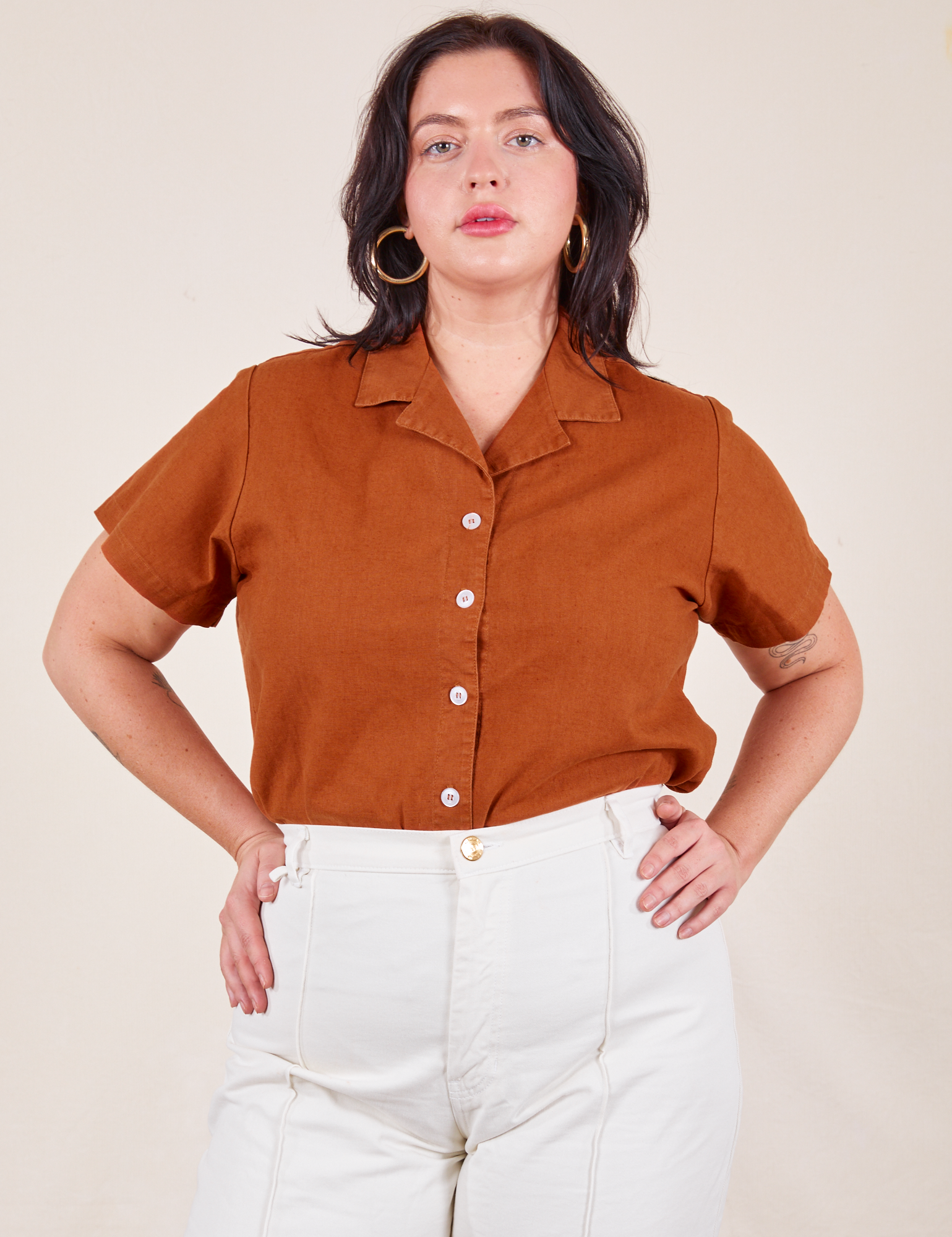 Faye is wearing M Pantry Button-Up in Burnt Terracotta tucked into vintage tee off-white Western Pants