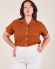 Faye is wearing M Pantry Button-Up in Burnt Terracotta tucked into vintage tee off-white Western Pants