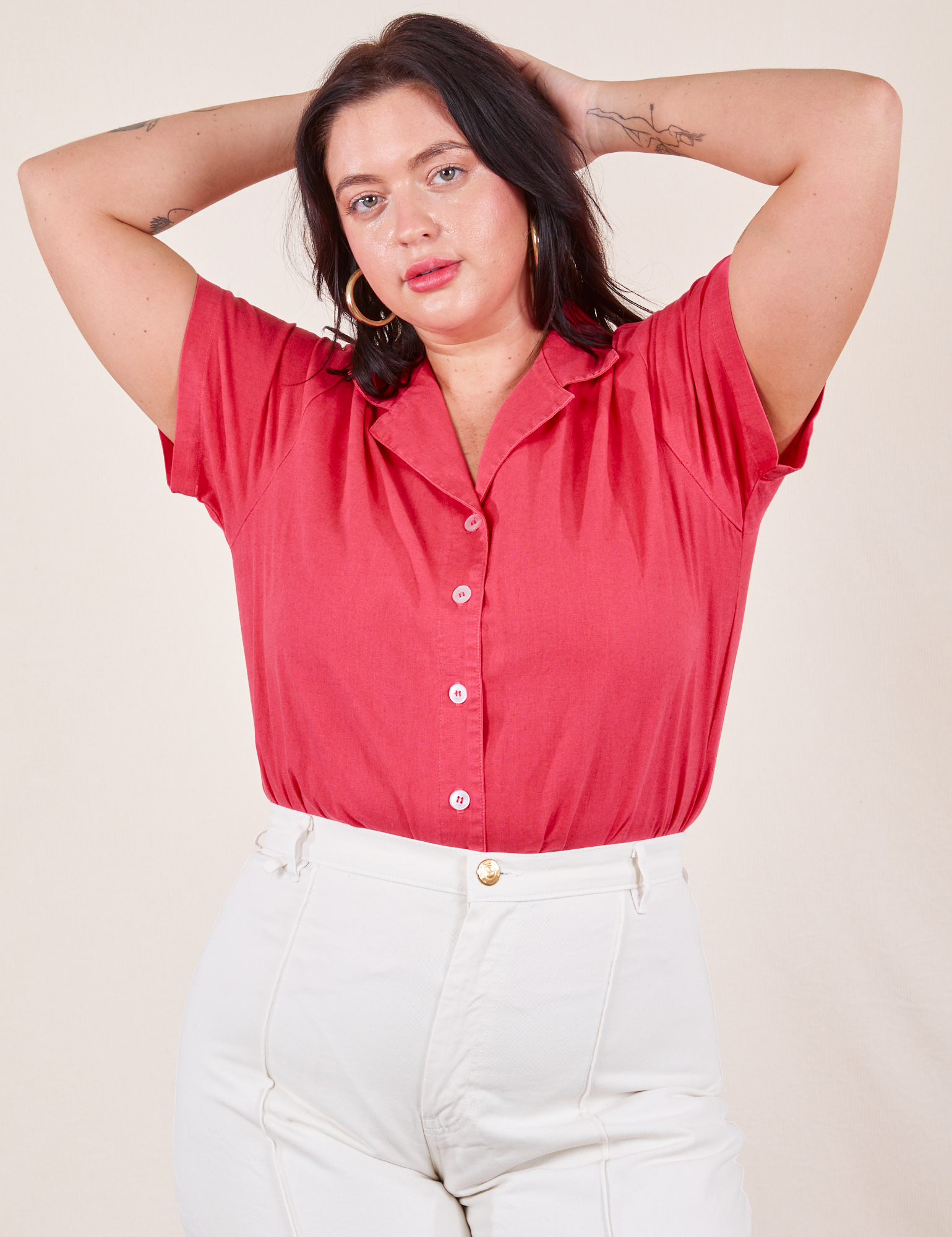 Faye is wearing M Pantry Button-Up in Hot Pink tucked into vintage off-white Western Pants