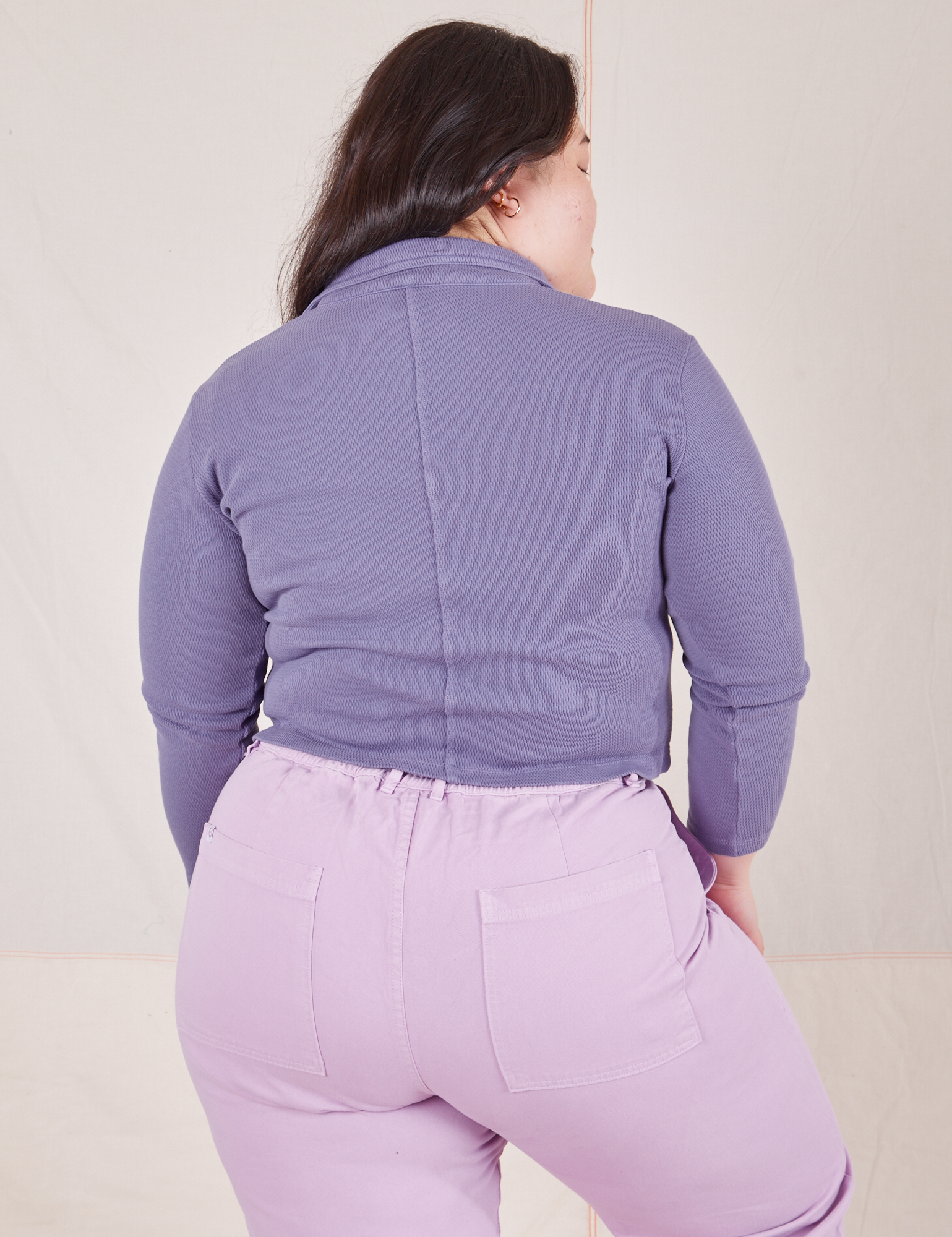 Back view of Long Sleeve Fisherman Polo in Faded Grape worn by Ashley