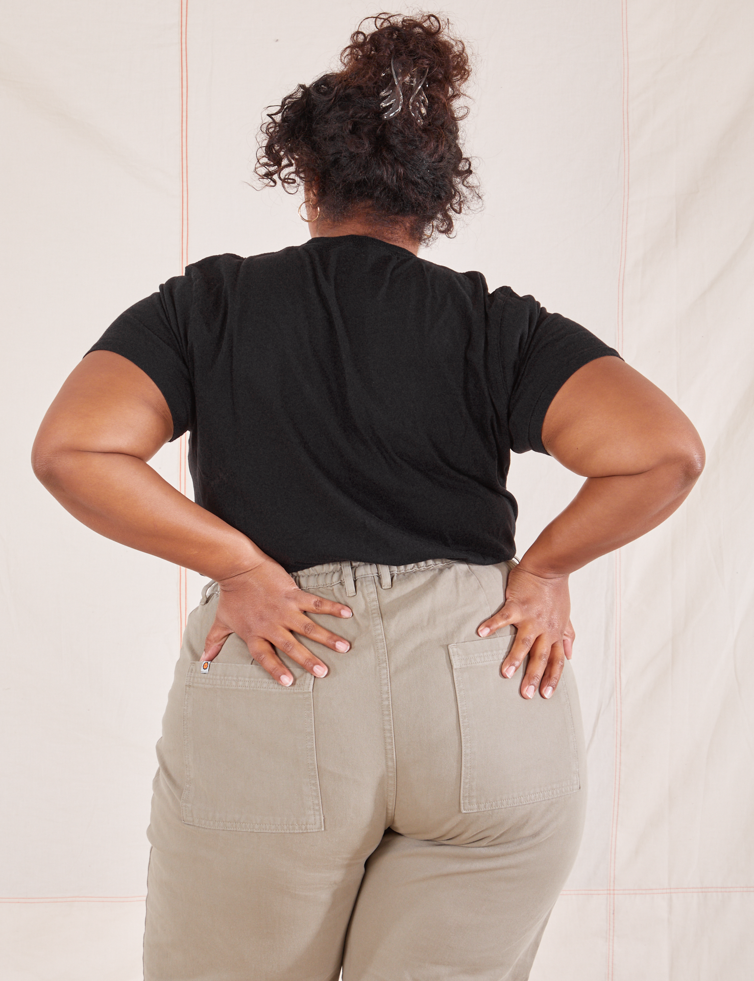 Back view of Organic Vintage Tee in Basic Black worn by Morgan