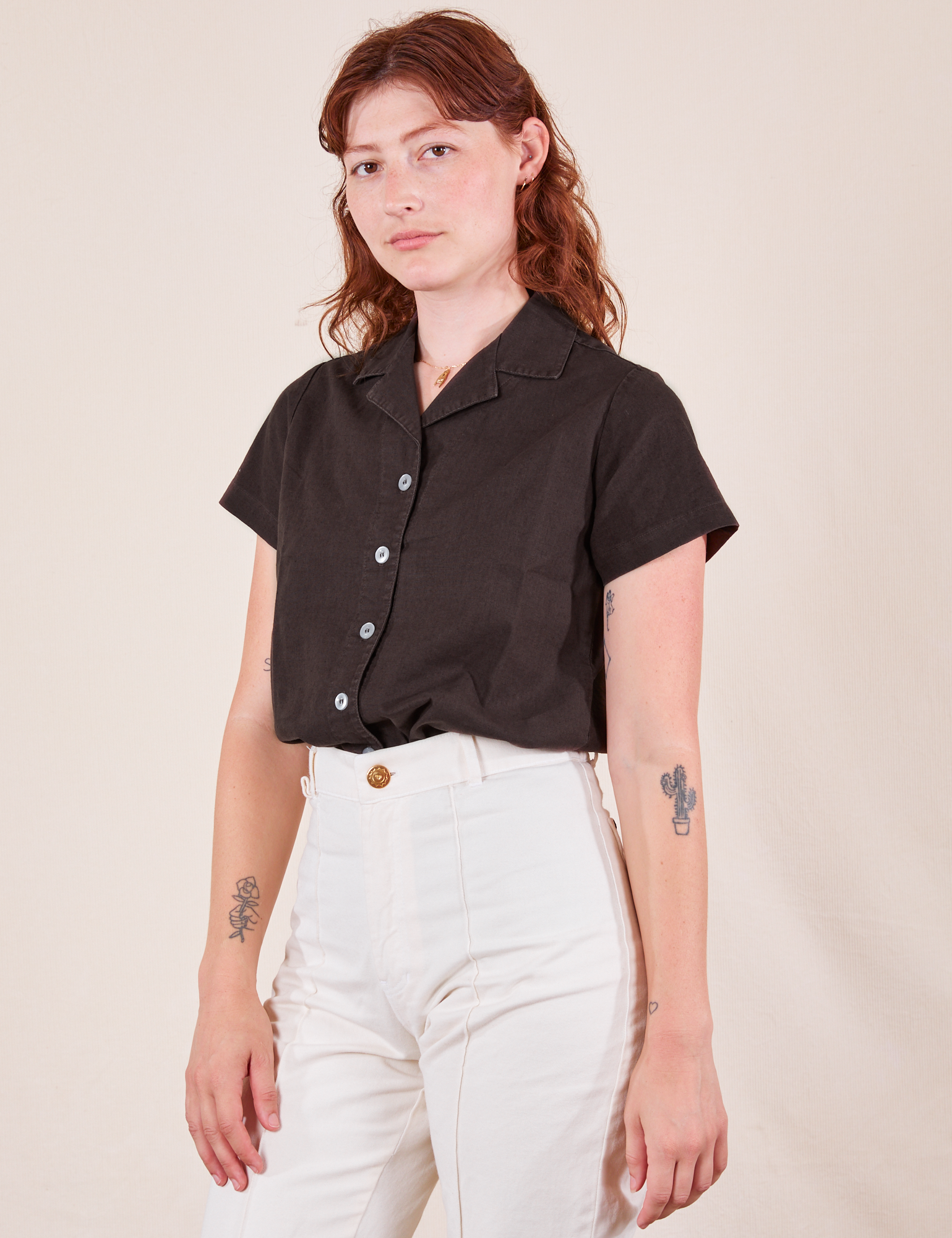 Alex is wearing P Pantry Button-Up in Espresso Brown tucked into vintage off-white Western Pants