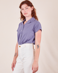 Angled view of Pantry Button-Up in Faded Grape and vintage tee off-white Western Pants worn by Alex
