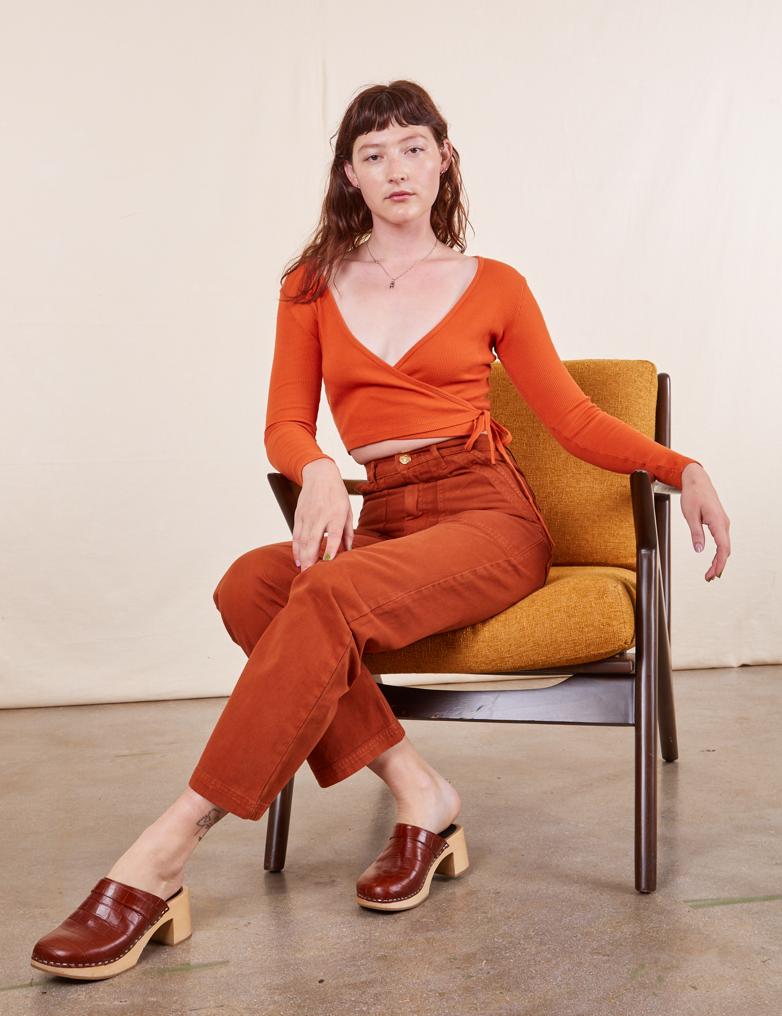 Alex is wearing Work Pants in Burnt Terracotta